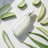 aloe-composition Cleanser bottle resting on a clean, light-colored surface