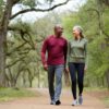 Couple enjoying a brisk walk in the park after jogging