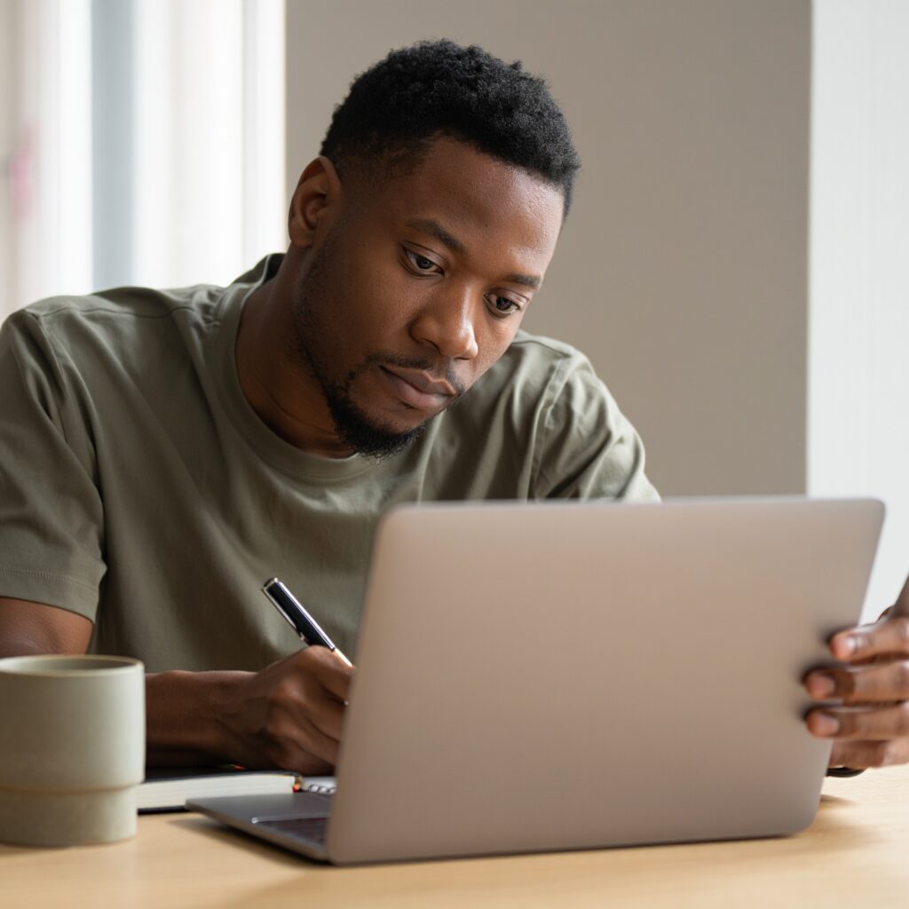 Deeply focused man working at notebook