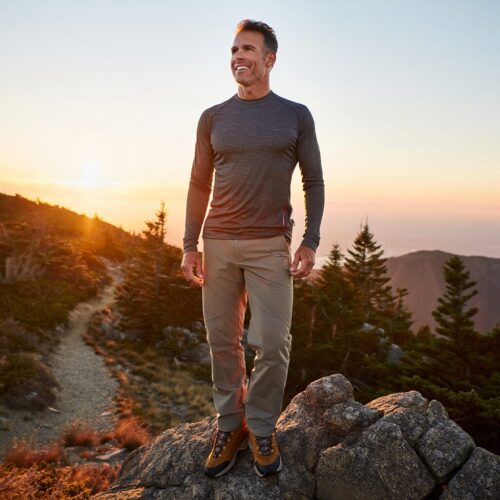 Active middle-aged man hiking on a nature trail